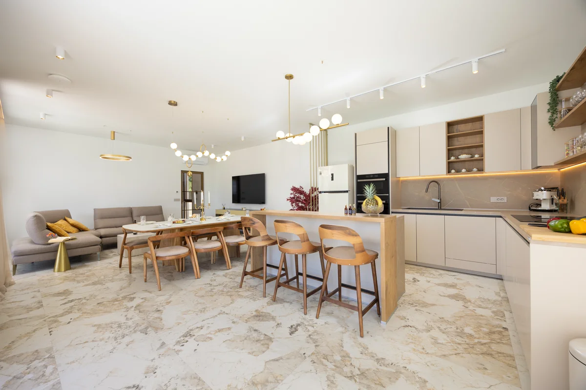 a kitchen with a dining table and chairs