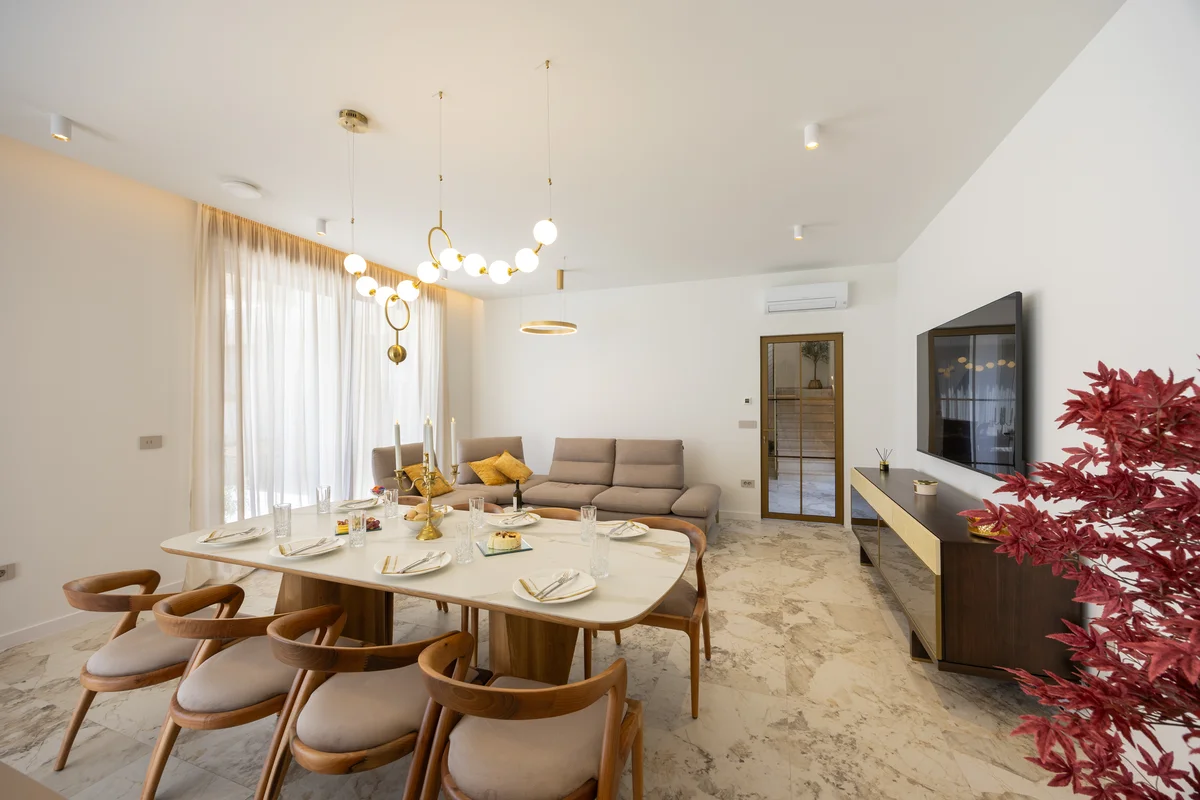 a dining room with a table and chairs