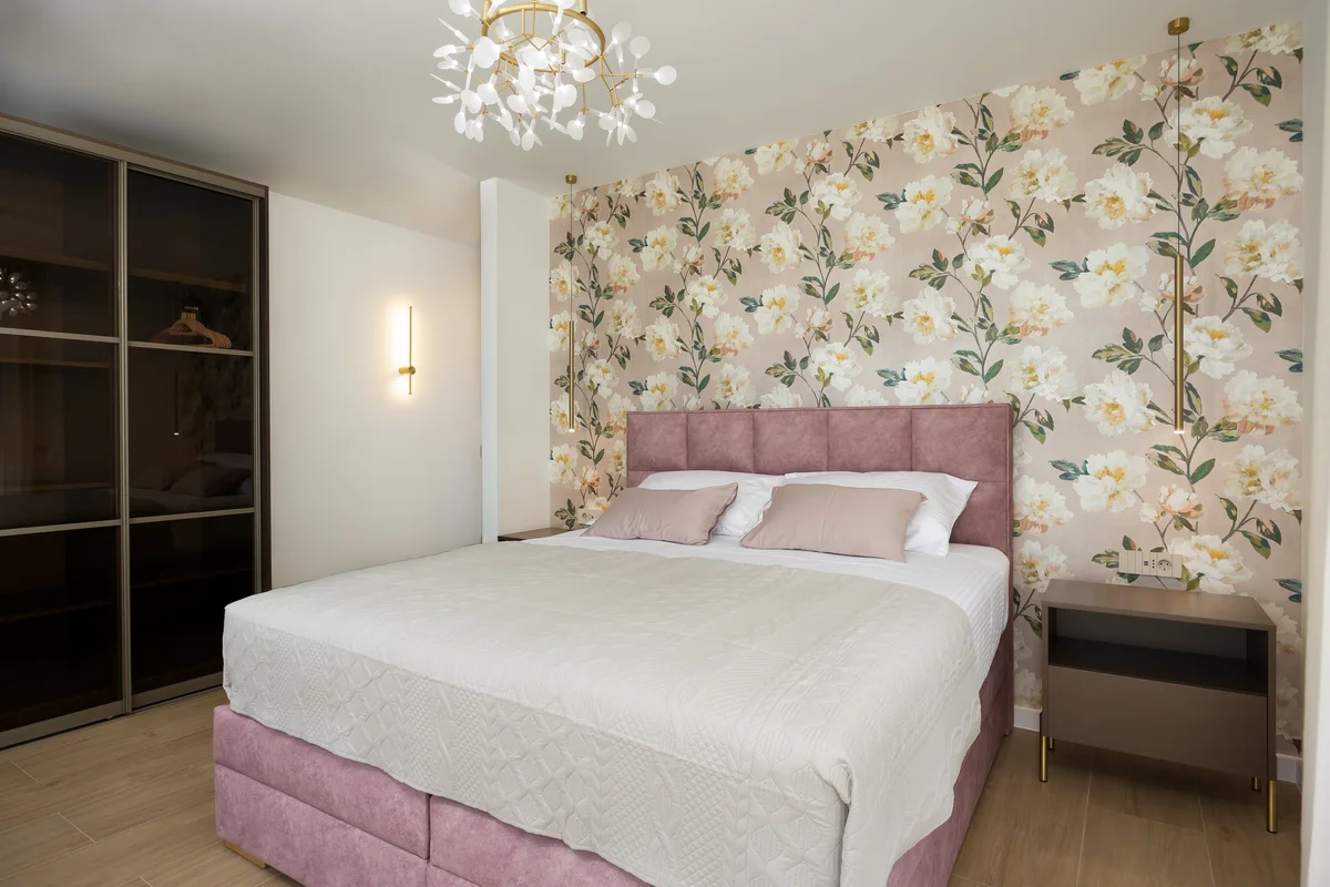 a bed with pink sheets