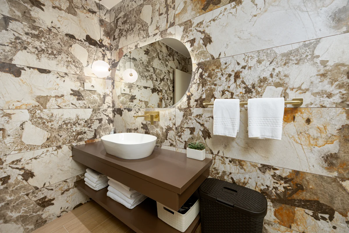 a bathroom with a sink and mirror