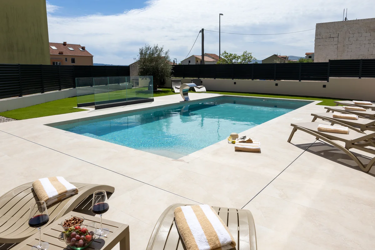 a pool with a table and chairs