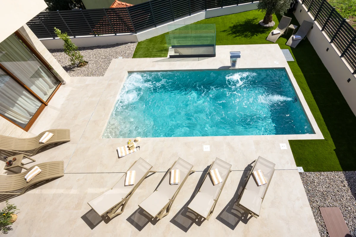 a swimming pool with a deck and a deck and a pool